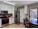Eat in kitchen features stainless appliances, white cabinets and granite countertops at 6049 S Wilson Dr, Chandler, AZ 85249