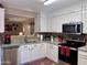 Bright kitchen boasts stainless steel appliances, granite countertops and an open floor plan at 6049 S Wilson Dr, Chandler, AZ 85249
