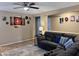 Comfortable living room features a sectional sofa and nostalgic artwork at 6049 S Wilson Dr, Chandler, AZ 85249