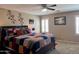 Comfortable main bedroom offering a ceiling fan, natural light, and calming paint colors at 6049 S Wilson Dr, Chandler, AZ 85249