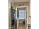 Mud room near kitchen with stainless steel fridge, wine rack, and laundry area at 6049 S Wilson Dr, Chandler, AZ 85249