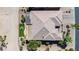 Aerial view features the home's landscaped backyard with covered patio, pergola, and mature trees at 6131 S Bradshaw Way, Chandler, AZ 85249