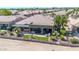 Aerial view of backyard featuring covered patio with seating, lush landscaping, and privacy fence at 6131 S Bradshaw Way, Chandler, AZ 85249
