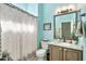 Bright bathroom with a decorative shower curtain, modern fixtures, and vanity creating a refreshing space at 6131 S Bradshaw Way, Chandler, AZ 85249