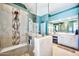 Elegant bathroom features a glass shower, double vanity, and a large mirror, creating a spa-like retreat at 6131 S Bradshaw Way, Chandler, AZ 85249