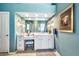 Bright bathroom featuring white cabinetry, vanity with a makeup area, and modern fixtures, a serene atmosphere at 6131 S Bradshaw Way, Chandler, AZ 85249