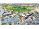 Aerial view of the community amenities including a golf course, swimming pools, tennis courts, and clubhouse at 6131 S Bradshaw Way, Chandler, AZ 85249