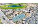 Overhead view of the community showcasing various recreational facilities, from tennis courts to pools and the verdant golf course at 6131 S Bradshaw Way, Chandler, AZ 85249