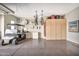 Spacious garage featuring epoxy flooring, a golf cart, built-in cabinets, and ample storage at 6131 S Bradshaw Way, Chandler, AZ 85249