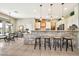 Bright kitchen featuring counter seating, stylish backsplash, and modern light fixtures at 6131 S Bradshaw Way, Chandler, AZ 85249