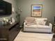 Cozy living room featuring stylish decor, a plush throw, and a warm, inviting ambiance at 6131 S Bradshaw Way, Chandler, AZ 85249