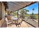 Charming covered patio area with outdoor seating, pergola, and views of the manicured backyard at 6131 S Bradshaw Way, Chandler, AZ 85249