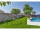Lush backyard featuring a pool, playground, and ample space for outdoor activities, perfect for Gathering enjoyment at 6321 W Gross Ave, Phoenix, AZ 85043