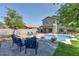 Spacious backyard with a pool, patio, and lounge area, perfect for outdoor entertaining at 6321 W Gross Ave, Phoenix, AZ 85043