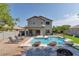 Private backyard oasis with a sparkling pool, comfortable seating, and a covered patio at 6321 W Gross Ave, Phoenix, AZ 85043