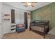 Cozy bedroom featuring a modern accent wall and comfortable furnishings at 6321 W Gross Ave, Phoenix, AZ 85043
