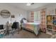 Charming bedroom with a playful design and a bright colorful scheme and a desk at 6321 W Gross Ave, Phoenix, AZ 85043