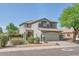 Charming two-story home with a neutral color palette and a well-maintained front yard at 6321 W Gross Ave, Phoenix, AZ 85043