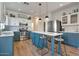 Beautiful kitchen with stainless steel appliances, center island, and custom cabinets at 6321 W Gross Ave, Phoenix, AZ 85043