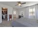 Cozy bedroom featuring a walk-in closet, soft natural light, and vanity for a relaxing, personal space at 6321 W Gross Ave, Phoenix, AZ 85043