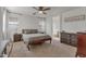 Serene bedroom with soft neutral tones, offering a calming retreat with natural light and elegant furnishings at 6321 W Gross Ave, Phoenix, AZ 85043