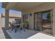 Covered patio with outdoor dining area, perfect for enjoying meals with a view of the pool at 6321 W Gross Ave, Phoenix, AZ 85043