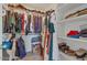 Spacious walk-in closet with ample storage, featuring organized shelving and hanging space for clothing and accessories at 6321 W Gross Ave, Phoenix, AZ 85043