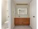 Bathroom featuring wooden vanity and sink at 643 W Medina Ave, Mesa, AZ 85210
