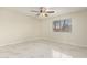 Bedroom with ceiling fan, bright light, and marble flooring is move-in ready at 643 W Medina Ave, Mesa, AZ 85210