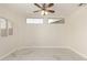 Bedroom features a ceiling fan, bright lighting, and marble floors at 643 W Medina Ave, Mesa, AZ 85210