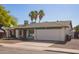 Charming single-Gathering home with a two-car garage, front yard landscaping, and mature shade trees at 643 W Medina Ave, Mesa, AZ 85210