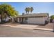Charming single-Gathering home with a two-car garage, front yard landscaping, and mature shade trees at 643 W Medina Ave, Mesa, AZ 85210