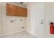 Laundry room features plenty of storage space at 643 W Medina Ave, Mesa, AZ 85210
