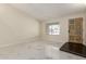 Bright living room features stylish marble flooring, neutral walls, and natural light from a window at 643 W Medina Ave, Mesa, AZ 85210