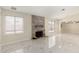 Living room with two windows, fireplace, and white marble floors at 643 W Medina Ave, Mesa, AZ 85210