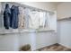 Spacious walk-in closet with ample hanging space and basket, perfect for organizing clothes and accessories at 644 N Vine St, Chandler, AZ 85225