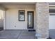 Welcoming entryway with stone accent wall, modern door, and large window at 644 N Vine St, Chandler, AZ 85225