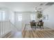 Upstairs loft area featuring wood floors, lots of natural light, ceiling fan, and a versatile space for various uses at 644 N Vine St, Chandler, AZ 85225