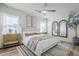 Bright main bedroom with modern decor, lots of natural light, and wood floors at 644 N Vine St, Chandler, AZ 85225