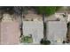 Overhead view of homes with well-maintained roofs and yards, showcasing the neighborhood's tidy and appealing appearance at 7029 S Golfside Ln, Phoenix, AZ 85042