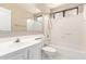 Bright bathroom with vanity sink, toilet, and shower-tub combination at 7029 S Golfside Ln, Phoenix, AZ 85042