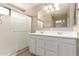 Bathroom with double sink vanity and a glass shower at 7029 S Golfside Ln, Phoenix, AZ 85042