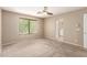 Bedroom featuring carpeted floors, a window and ceiling fan at 7029 S Golfside Ln, Phoenix, AZ 85042