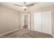 Bedroom boasts carpet, closet, and doorway to hall at 7029 S Golfside Ln, Phoenix, AZ 85042