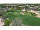 Aerial view of golf course highlighting its lush fairways, bunkers, and manicured putting greens, ideal for golf enthusiasts at 7029 S Golfside Ln, Phoenix, AZ 85042
