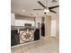Well-lit kitchen features white cabinets, black appliances, a black countertop and tile flooring at 7029 S Golfside Ln, Phoenix, AZ 85042