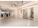 Open concept living space showcasing high ceilings, clerestory windows, a staircase, and tile flooring at 7029 S Golfside Ln, Phoenix, AZ 85042