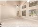 Bright, open living space with soaring ceilings, clerestory windows, and neutral tile flooring at 7029 S Golfside Ln, Phoenix, AZ 85042
