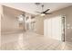 Bright, open living space with soaring ceilings, clerestory windows, and neutral tile flooring at 7029 S Golfside Ln, Phoenix, AZ 85042