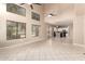 Bright, open living space with soaring ceilings, clerestory windows, and neutral tile flooring at 7029 S Golfside Ln, Phoenix, AZ 85042